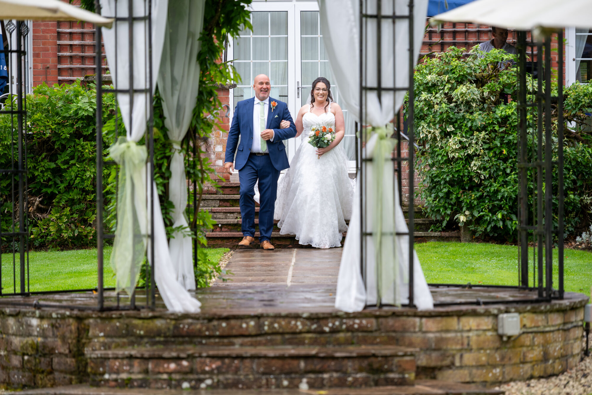 Fox and Hounds Country Hotel Wedding Photography Walking down the isle