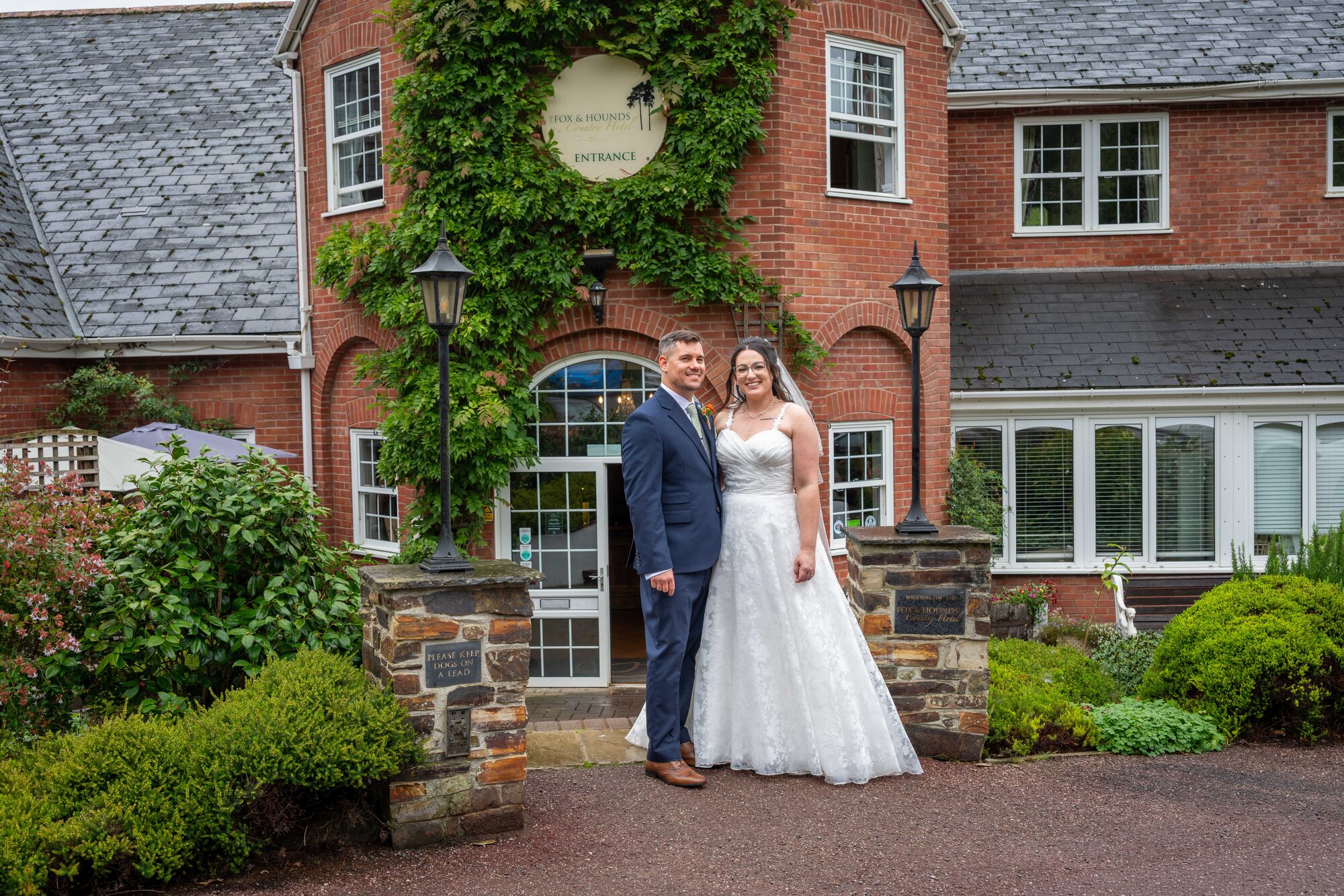 Bride and groom outside Fox & Hounds Country Hotel in Chulmleigh
