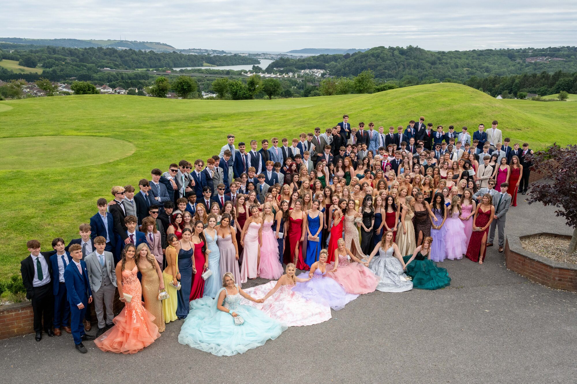 Students from Hele's School posing at Boringdon Park during sunset