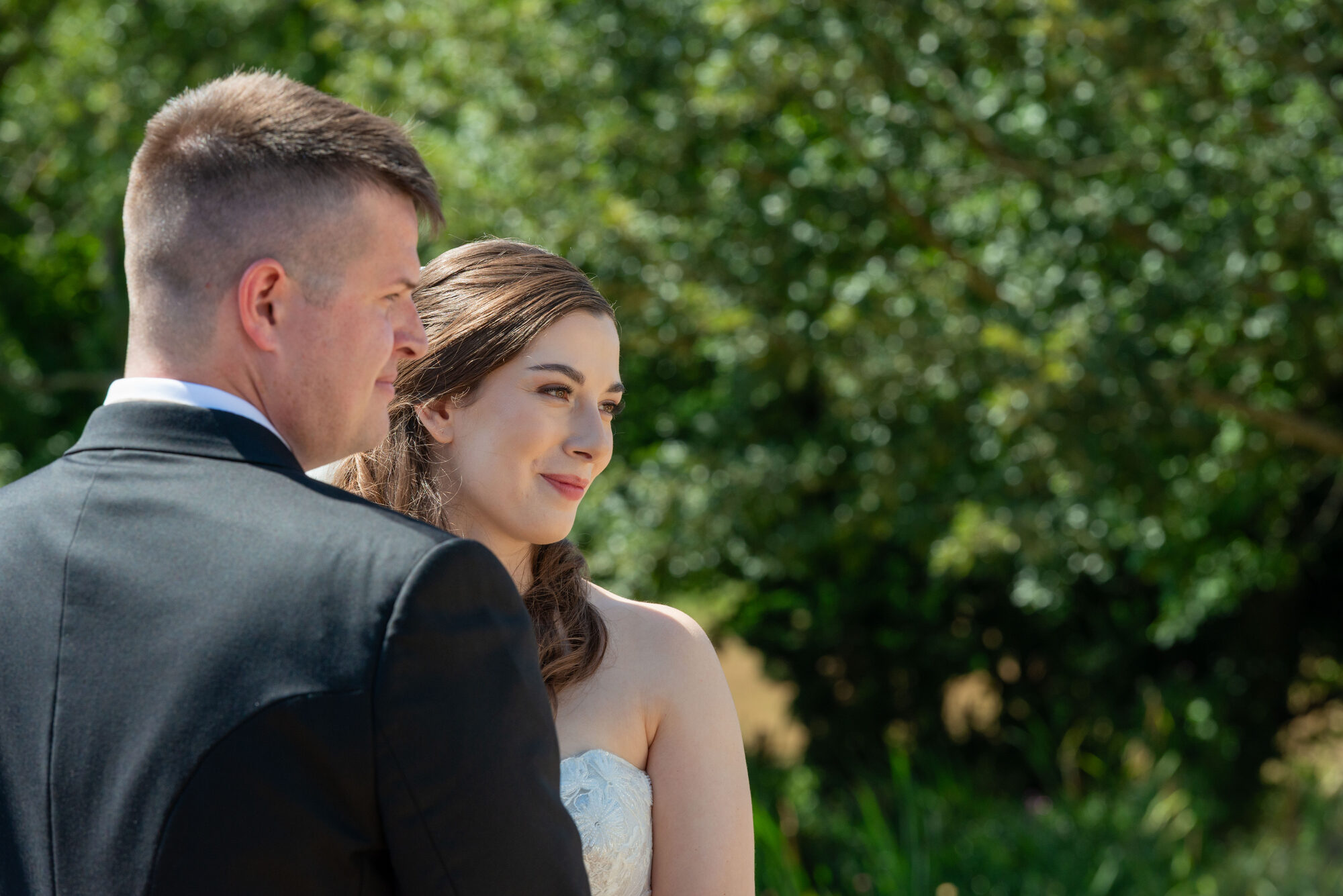 Bride and groom at the altar during outdoor wedding at Rockbeare Manor