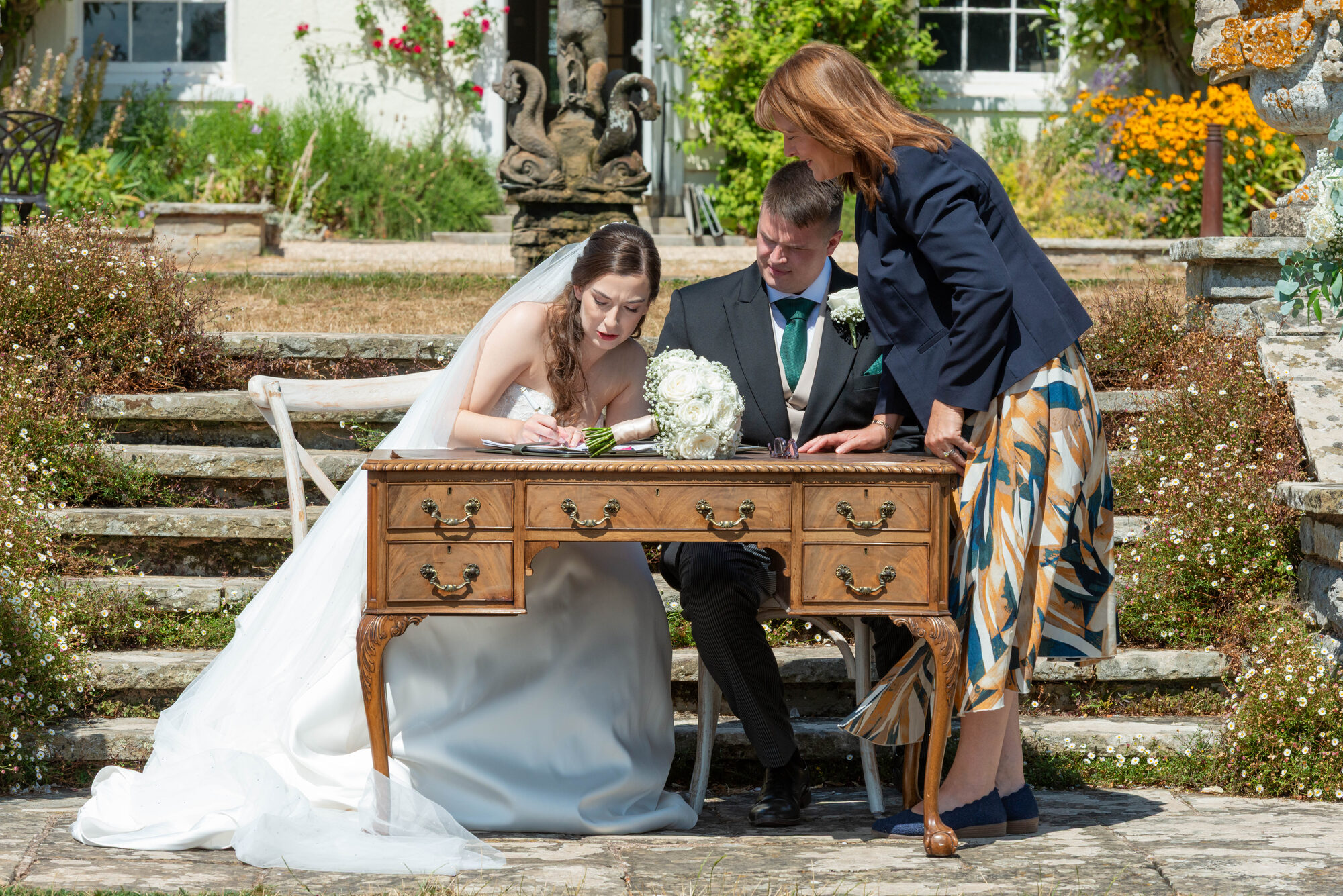 Signing the register after the ceremony at Rockbeare Manor