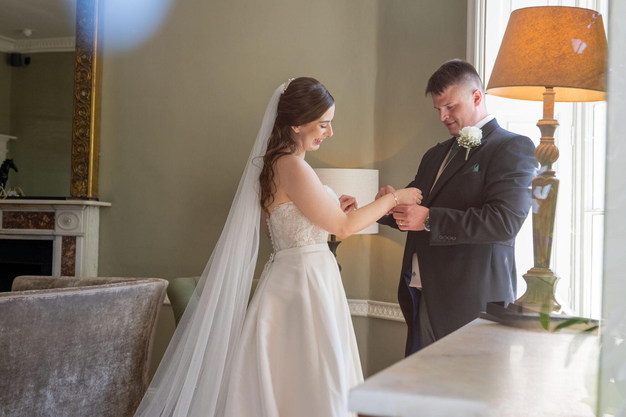 Groom giving his bride a surprise gift after the ceremony at Rockbeare Manor