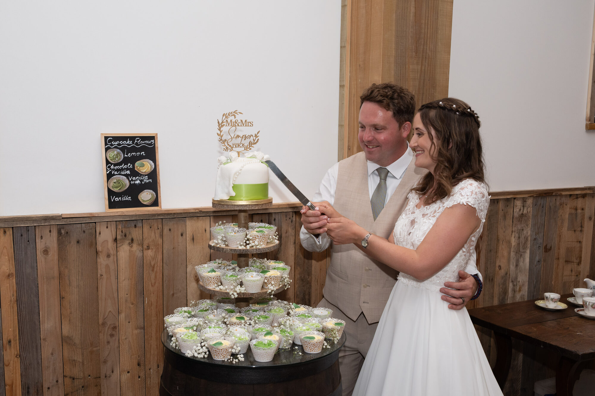 Bride and groom cutting their wedding cake at Valleyside Barn