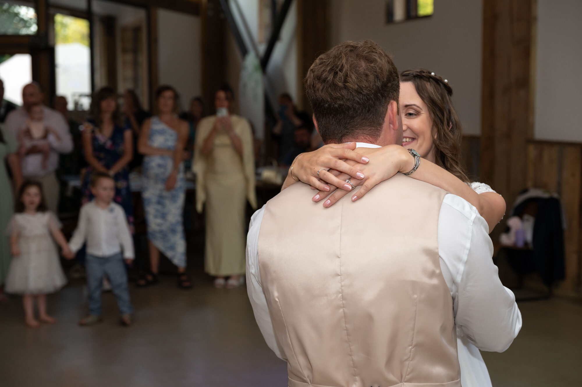 Romantic first dance at Valleyside Barn under wooden beams