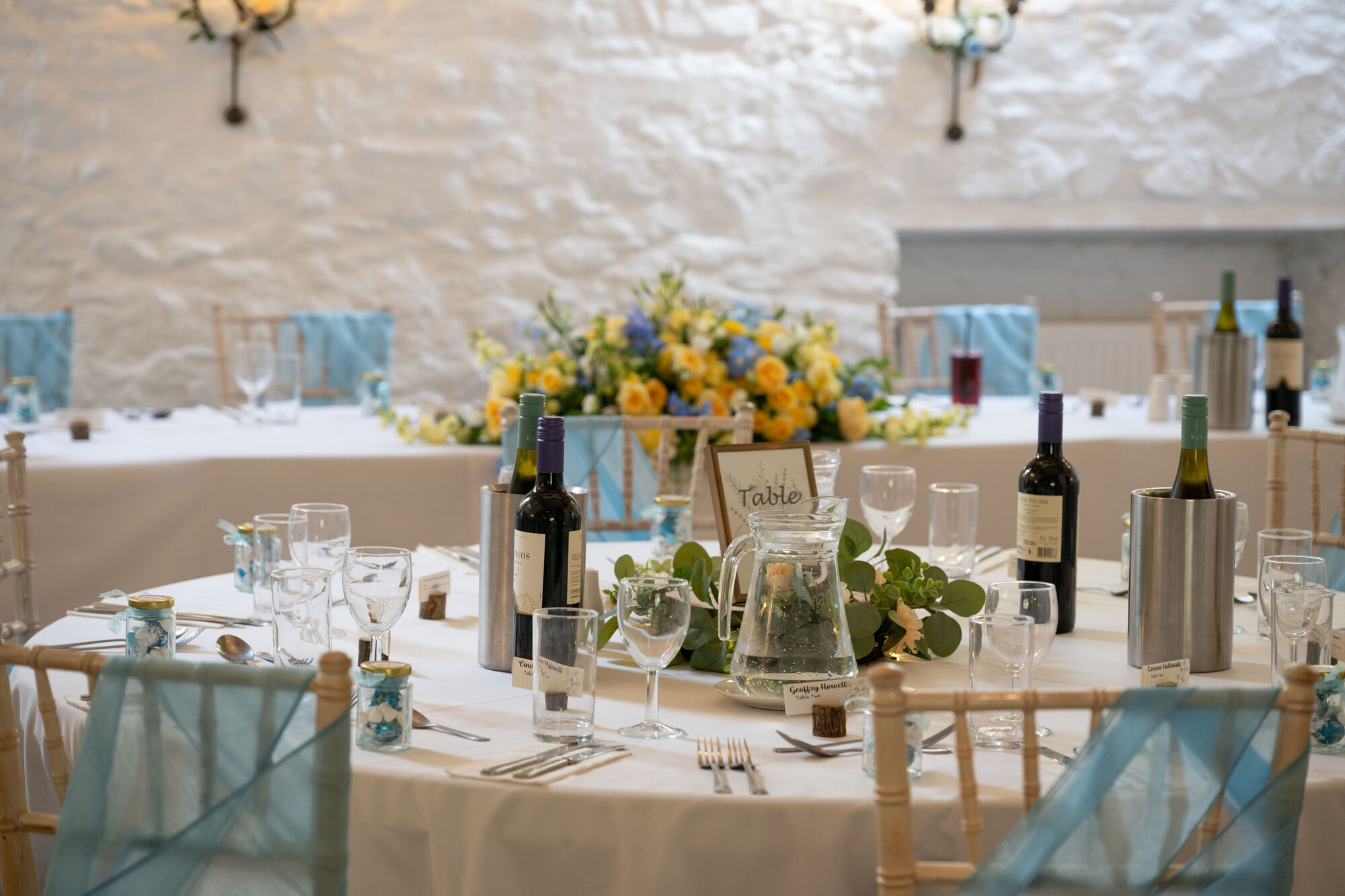 Wedding breakfast room at Bickley Mill styled with elegant table settings