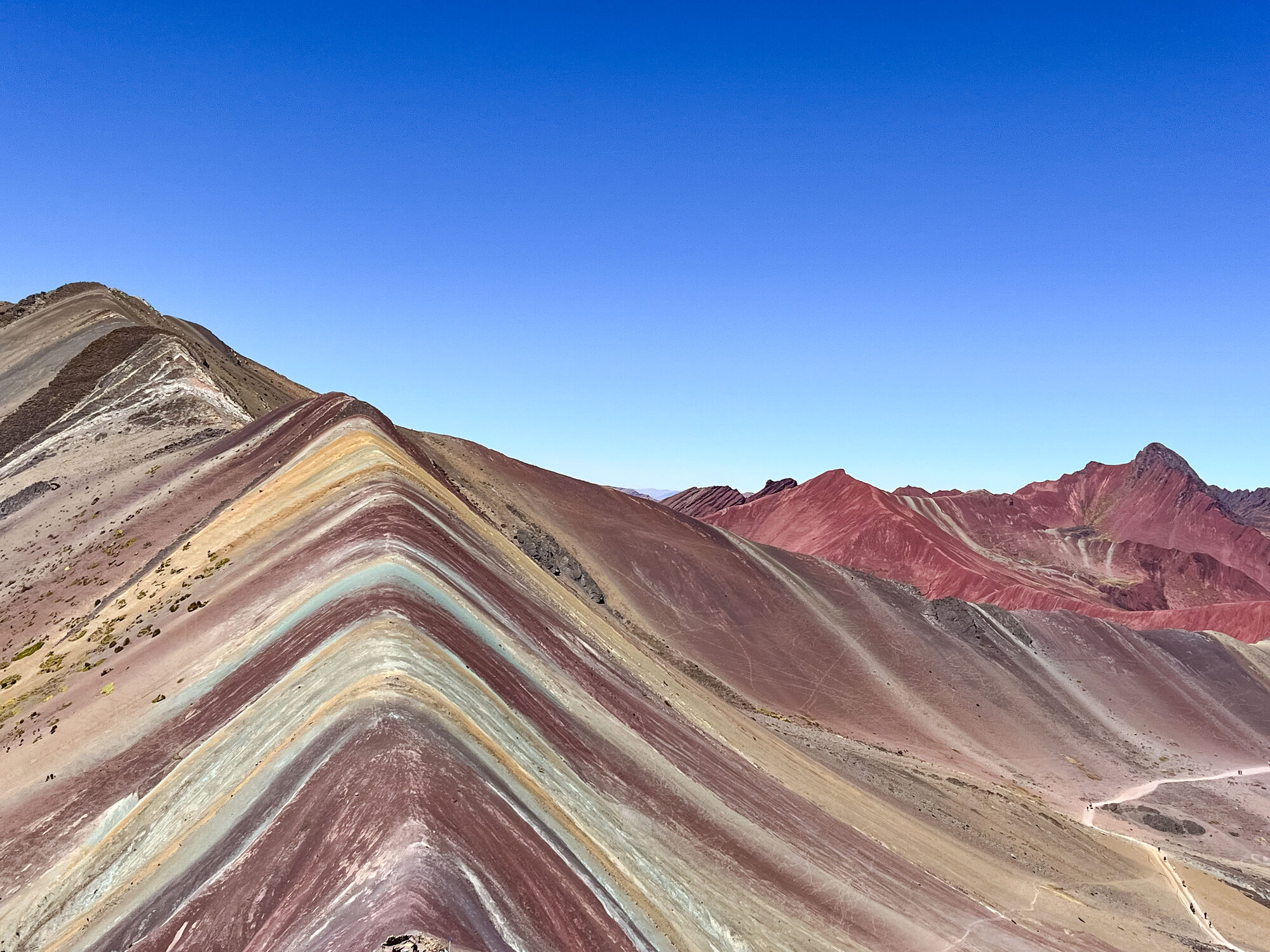 Mike Lister at Rainbow Mountain after completing the Salkantay Trek for HD Livin