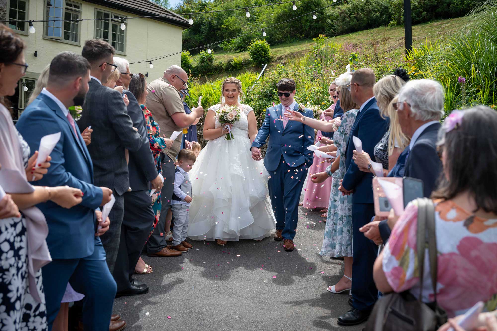 Devon wedding photographer capturing emotional moment at Bickley Mill, Devon